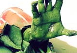 Green hand sculptures by Lukas Lukero Art