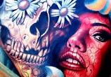 Skull and muerte breast tattoo by Nikko Hurtado
