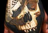 Skull hand tattoo by Nikko Hurtado