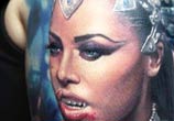 Realistic vampire woman tattoo by Paul Acker