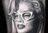 Marilyn Monroe with glasses tattoo by Sergey Shanko