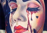 Clown face tattoo by Valentina Ryabova
