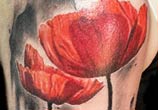 Red tulip tattoo by Zsofia Belteczky