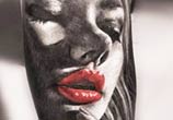 Woman face tattoo by Zsofia Belteczky